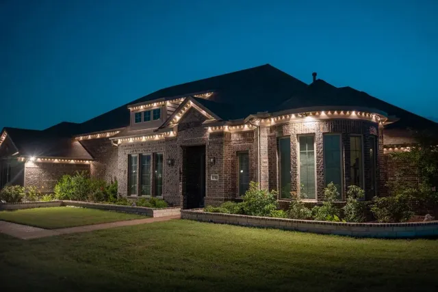Accent lighting on a home at twilight